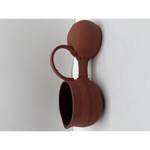 traditional weeping vase, also known as a Huron-Wendat vase.  Terracotta